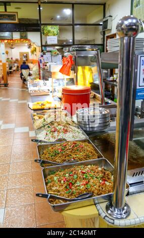 Kuala Lumpur, Malaysia - April 2017. Food laid out in restaurant for self service. Stock Photo