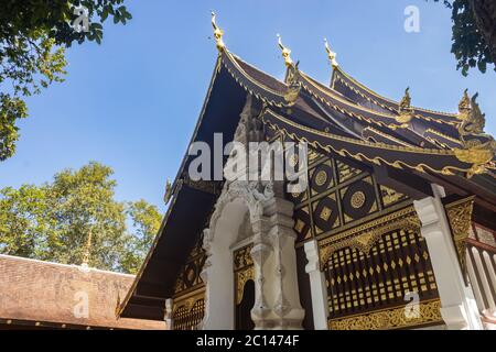 Phayao, Thailand - Nov 24, 2019: Buddhist Church in Analayo Temple or Wat Analayo on Blue Sky Background in Low Angle View with Natural Light Stock Photo