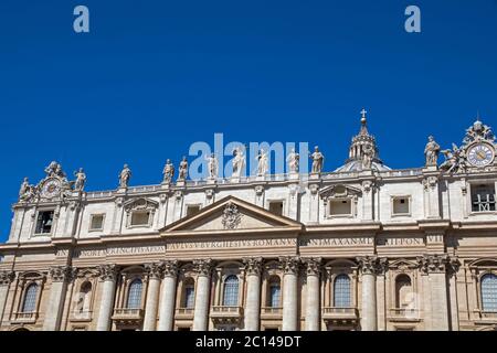 The facade of St Peter's Basilica in Rome featuring statues of Jesus and his disciples Stock Photo