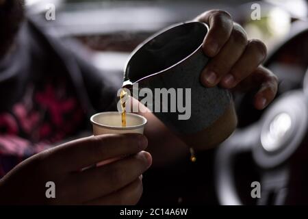 pouring brewing coffee with ceramic cup with beautiful light and depth of field Stock Photo