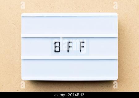 White lightbox with word BFF (Abbreviation of best friend forever) on wood background Stock Photo