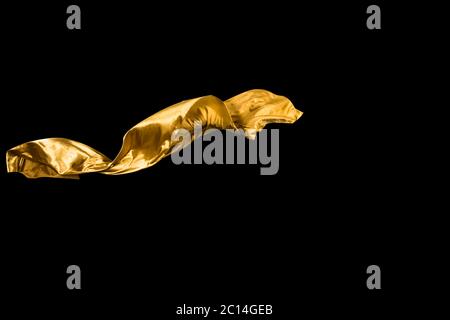 golden soft satin flying in wind on background Stock Photo