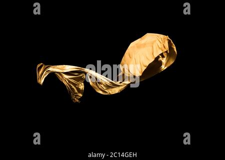 golden soft satin flying in wind on background Stock Photo