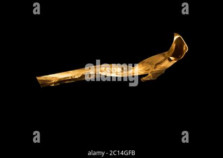 golden soft satin flying in wind on background Stock Photo