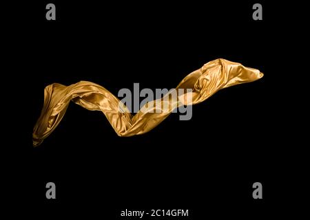 golden soft satin flying in wind on background Stock Photo