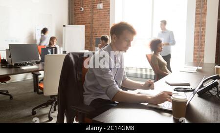 Diverse employees using, working on computers, everyday office routine Stock Photo