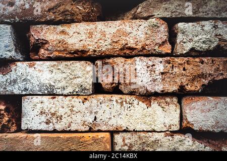 Pattern of decorative natural stone wall with stones in several colors, red, ancient color with modern style of stone, red, yellow stone to light Stock Photo