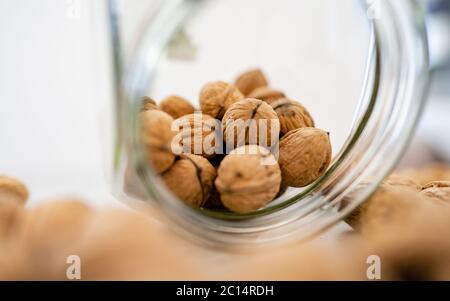 Concept healthy walnut kernels in a glass bowl. Good carbohydrate to provide nutrition! Illuminated with natural light. Stock Photo