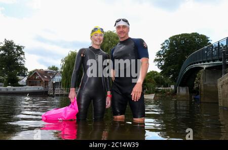 London, UK. 14 June 2020  Open water swimmers, Stuart Leigh & Fiona Buchanan swim in the River Thames, around Eel Pie Island, Twickenham, at a time when swimming pools are closed due to the coronavirus.  Andrew Fosker / Alamy Live News Stock Photo