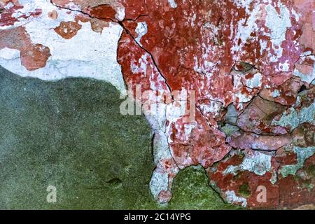 Decayed old white wall with red bricks, background Stock Photo