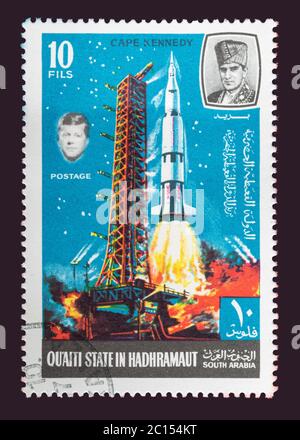 One of a set of seven Vintage cancelled postage stamp from Quaiti State or South Arabia. Stamp Circa 1969 featuring scenes of the exploration of space Stock Photo