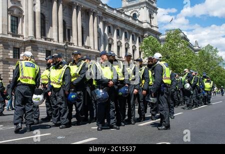 Riot police in Whitehall on standby to prevent Britain First far right supporters clashing with Black Lives Matter anti-racism protesters. Stock Photo
