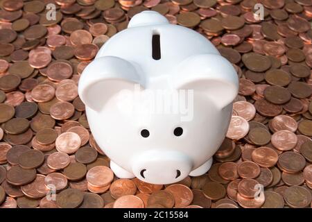 Piggy bank on pile of Euro cents Stock Photo