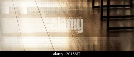 light and shadow abstract architecture interior metal leg table and wwod floor dark loft style banner background Stock Photo