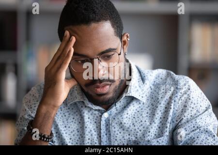 African businessman thinking of problem solution feels concerned Stock Photo