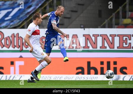 Karlsruhe, Deutschland. 14th June, 2020. Philipp Hofmann (KSC) in one shot versus Holger Badstuber (VfB Stuttgart). GES/Football/2nd Bundesliga: Karlsruher SC - VfB Stuttgart, 14.06.2020 Football/Soccer: 2nd League: Karlsruher Sport-Club vs VfB Stuttgart, Karlsruhe, June 14, 2020 | usage worldwide Credit: dpa/Alamy Live News Stock Photo