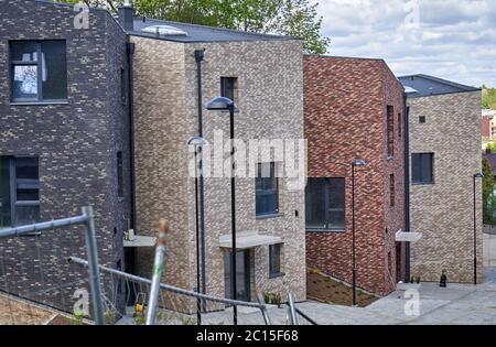 Fence of bricks. Wall with brick imitation decorative tiles. Copy space ...