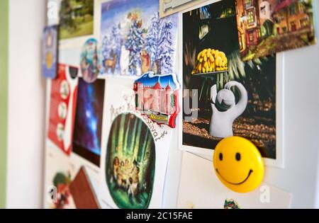 Collage of images and magnets with a smiling face Stock Photo