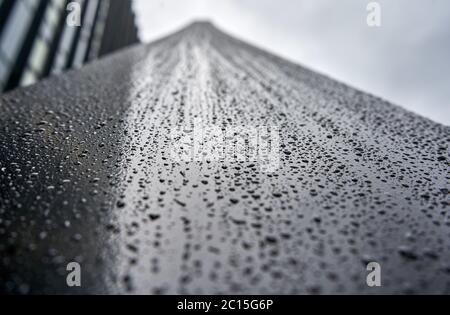 Water drops on the metal facing the sky Stock Photo