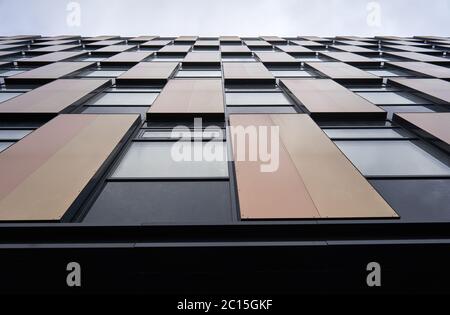 Modern office building with colorful panels on their facade Stock Photo