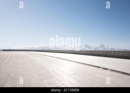 empty floor with white snow mountains Stock Photo