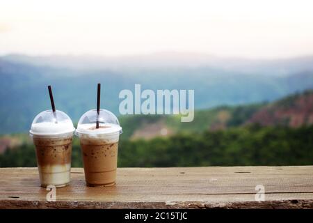 Iced coffee in tall glass. One sweet cold latte with whipped cream, with  chemex coffee maker on dark brown background copy space Stock Photo - Alamy