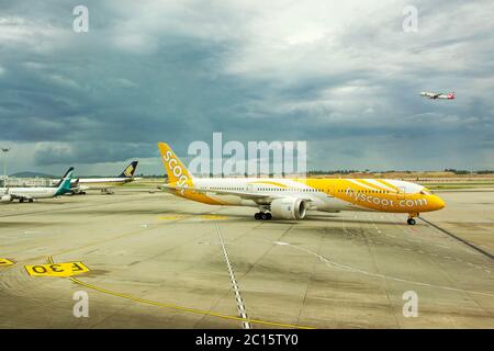 Singapore - April 04 2019: Scoot aircraft approaching at Changi International Airport (SIN) in Singapore. Scoot, Scoot Pte Ltd., is a Singaporean low- Stock Photo