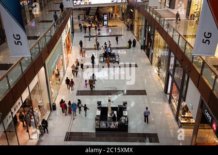 Dubai / United Arab Emirates - February 1, 2020: Indoor photo of Dubai Mall with multi ethnic crowd of tourists shopping on it Stock Photo