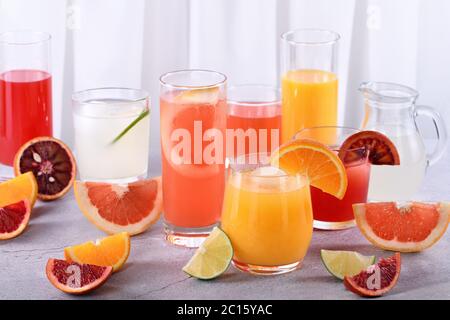 Refreshing fresh detox citrus juices from orange, sicilian orange, grapefruit, lime Stock Photo