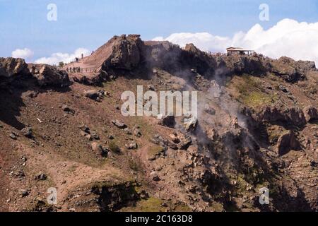 Smoke rises from within the cone at the peak of the summit caldera of Mount Vesuvius, an active volcano (somma-stratovolcano), Campania, Italy Stock Photo