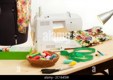 the sewing machine costs on a table Stock Photo