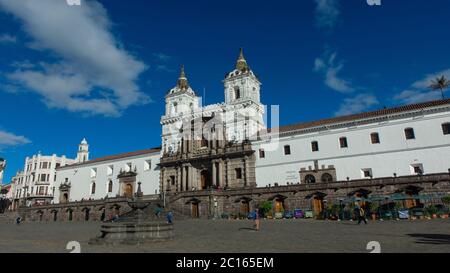 Quito, Pichincha / Ecuador - July 21 2018: People walking in front of Church and Monastery of San Francisco on a sunny day. It is a 16th-century Roman Stock Photo