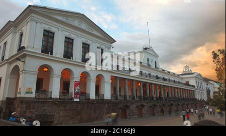 Quito, Pichincha / Ecuador - September 8 2018: People walking in front of Carondelet Palace, headquarters of the national government at sunset Stock Photo