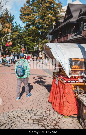 Zakopane, Poland - September 13, 2019: people walking by central krupowki street in tatra mountains Stock Photo