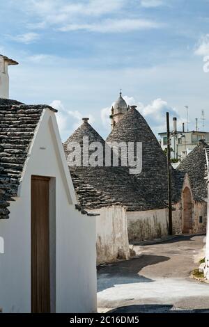 Typical street with Trulli houses in Alberobello, Puglia, Italy Stock Photo