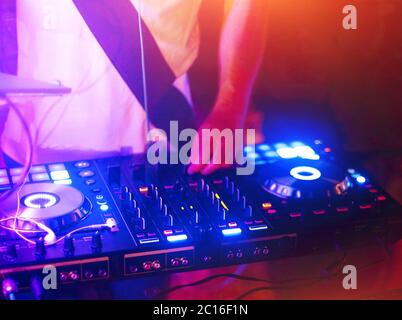 Dj mixes the track in the nightclub Stock Photo