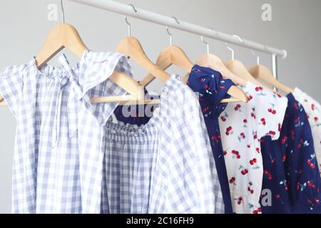 Variety of casual dresses on hangers Stock Photo