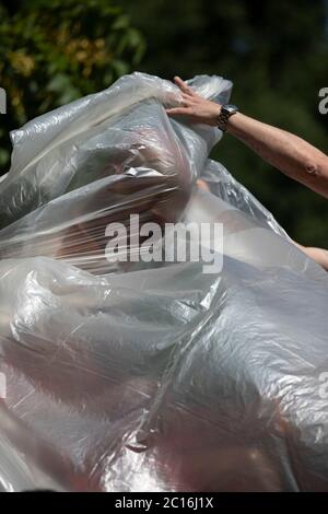 Milan, 14 June 2020. Indro Montanelli Park, the statue of the journalist Indro Montanelli is covered up waiting to be cleaned up. Stock Photo