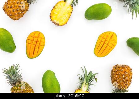 Sweet pineapple and mango fruits isolated on white background. Food frame. Flat lay, top view. Stock Photo