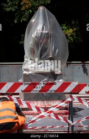 Milan, 14 June 2020. Indro Montanelli Park, the statue of the journalist Indro Montanelli is covered up waiting to be cleaned up. Stock Photo