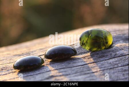 Dark green stone with deals black spots