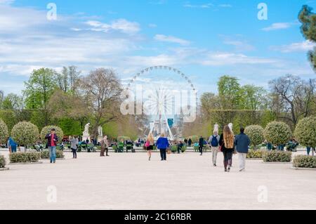 Landscape of Tuileries garden with Ferris wheel in Paris, France. Tuileries Garden is a public garden located between Louvre Mus Stock Photo