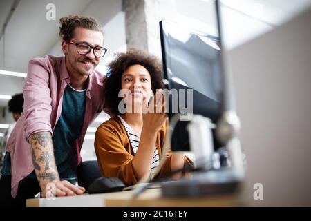Creative managers crew working with new startup project in office. Team brainstorming. Stock Photo