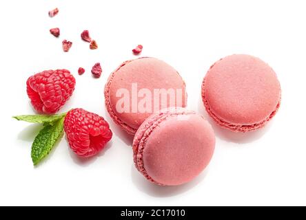 pink raspberry macaroons isolated on white background, top view Stock Photo