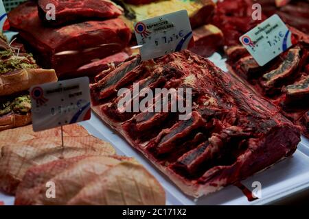 Raw rib of beef with bones on a display counter for diners to choose, Bordeaux, France Stock Photo