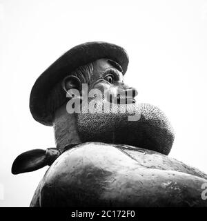 Monochrome (black and white) Desperate Dan statue in Dundee High Street, Scotland, United Kingdom. Stock Photo