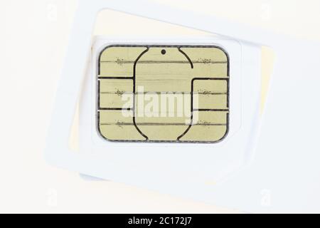 used mobile phone sim card macro on white background Stock Photo
