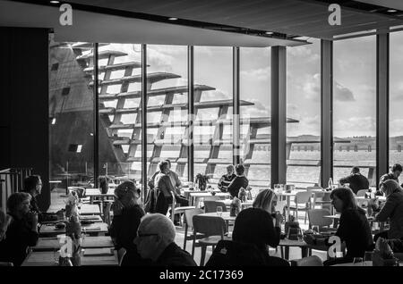 Monochrome (black and white) image of the restaurant in the V&A Dundee Building, Dundee, Scotland, United Kingdom. Stock Photo