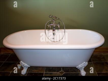 Vintage style white ball and claw bath tub Stock Photo