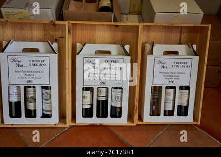 Three wine gift boxes of three-bottle coffrets from the regions of Saint-Emilion, Pomerol and Bergerac, on display, France Stock Photo